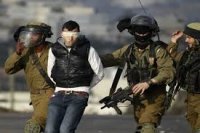 اعتقال 11 فلسطينيا بالضفة الغربية