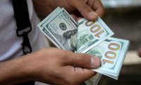 الدولار يتراجع مع تعزيز التفاؤل بشأن بايدن