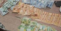ضبط 3 متسولين بحوزتهم 700 دينار ودفتر شيكات وأوراق إيداعات بـ 20 ألفا