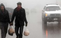 الأمن يحذر من المنخفض ويدعو للابتعاد عن السيول