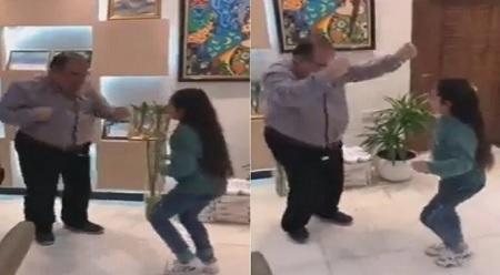 طبيب عراقي يراقص طفلة مريضة - فيديو