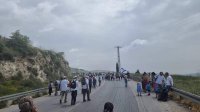 مستوطنون ينتشرون قرب قرية برقة قضاء  نابلس قبيل المشاركة في مسيرة استيطانية في بؤرة حومش المخلاة"